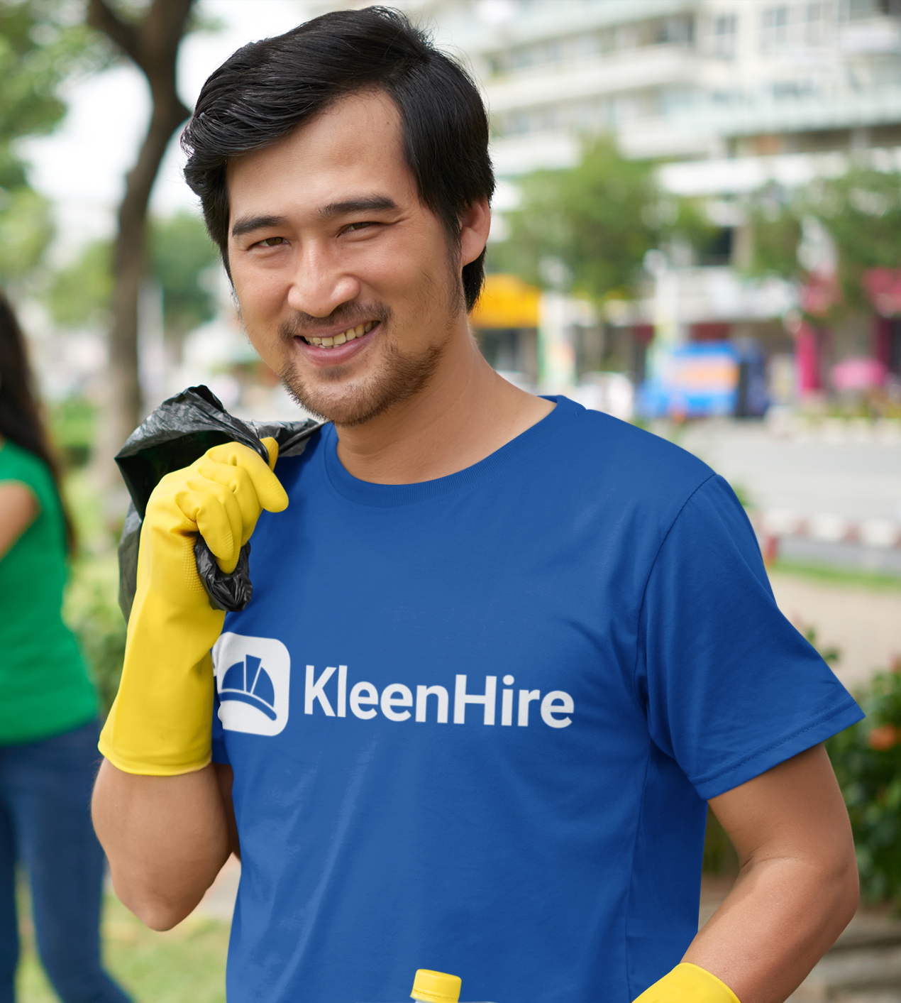 Professional cleaner in KleenHire uniform ready to work